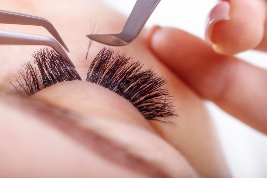 Eyelash Extension Procedure, Woman Eye with Long Eyelashes.